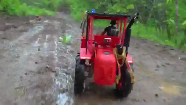 off-road-rescue-rcsparks-studio-frees-stranded-tractor-with-two-wheel-drive-truck